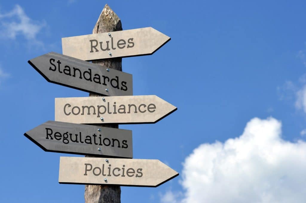 Wooden Signpost with Five Arrows and a bright blue sky at the background