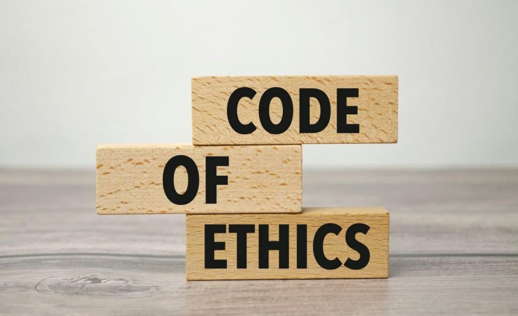 words code of ethics on small wooden blocks