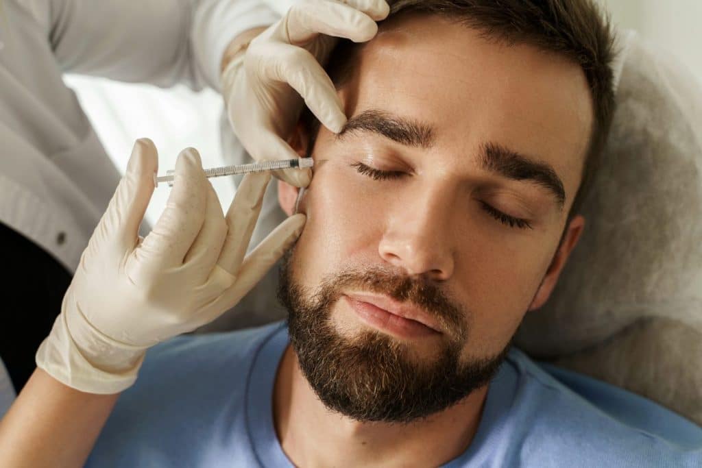 handsome man having a filler injection