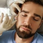 handsome man having a filler injection